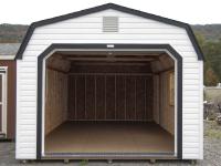 White and Black One-Car Garage With Open Overhead Door