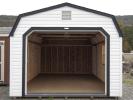 White and Black One-Car Garage With Open Overhead Door